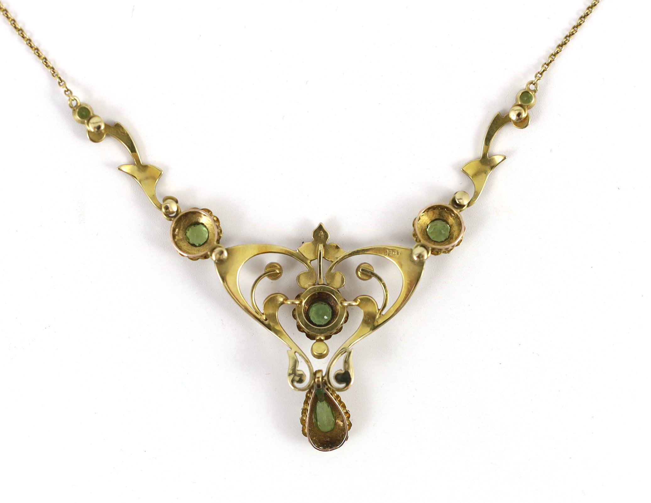 An Edwardian 15ct gold peridot and seed pearl cluster set drop pendant necklace